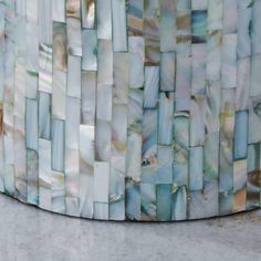 a close up of a table made out of mother of pearl tiles