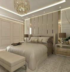 a bedroom with a large bed and chandelier