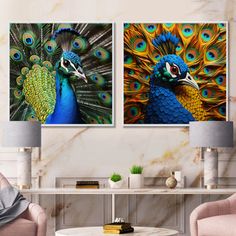 two paintings of peacocks are displayed in a living room with pink chairs and a coffee table