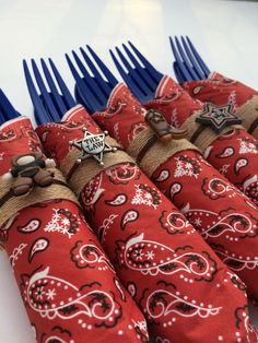 several red and white napkins with blue forks