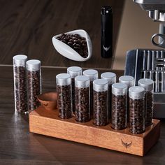 Experience the ultimate in coffee brewing precision with our KNODOS Coffee Dosing and Storage Set! An exceptional pairing of form and function, this collection includes our Single Dose Coffee Bean Storage Tubes and Coffee Bean Dosing Cup with Spray Bottle Set, crafted to ensure peak freshness and accurate dosing for every cup. Coffee Bean Storage Tubes Upgrade your coffee storage with our set of 10 airtight borosilicate glass tubes (2 oz each), complete with a solid wooden holder base and a walnut funnel for effortless, mess-free dosing. Each thick, durable tube holds up to 20 grams of beans, varying with the roast level. These versatile containers are also ideal for storing tea, spices, plants, and candy. By reducing air exposure, our tubes help you maintain optimal freshness and flavor i Coffee Beans Storage, Storage Tubes, Coffee Bean Storage, Sprayer Bottle, Coffee Storage, Coffee Bar Accessories, Tea Makers, Ceramic Vessel, Coffee Machines