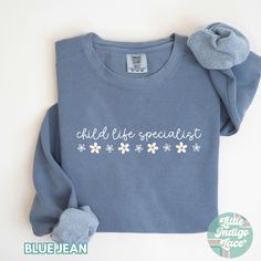 Child Life Specialist Sweatshirt for the CCLS! Makes for a great gift for any CLS advocate you know! Each sweatshirt comes with a relaxed fit, a rolled-forward shoulder, and a back neck patch. This is a Comfort Colors sweater.  ♡80% ring-spun cotton, 20% polyester ♡Medium-heavy fabric (9.5 oz /yd² (322.1 g/m ♡Relaxed fit ♡ DISCLAIMERS: - Colors may vary depending on the device you are viewing them on This item is made especially for you as soon as you place an order so it can take a little longe Rad Tech Shirt, Slp Shirts, Child Life Specialist, Mother Baby Nurse, Baby Nurse, Rad Tech, Sped Teacher, Comfort Colors Sweatshirt, Nurse Sweatshirt