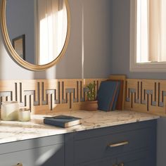 a bathroom with marble counter tops and blue cabinets