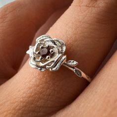 January Carnation Birth Flower Ring Material: Choose from Solid 14k Yellow Gold, 14k White Gold, 14k Rose Gold, or 925 Sterling Silver. Stone: 2 mm genuine AA grade brilliant cut Band: Solid 1.3 round band Carnation Flower: Garnet Ring Carnation meaning varies depending on the flower color. But at its heart, basic carnation flower meaning embraces the ideas of fascination, distinction, and love. The love aspect of carnation meaning includes everything from a mother's devoted love to a suitor's p Carnation Flower Meaning, Carnation Birth Flower, January Birth Month Flower, January Carnation, Garnet Birthstone, Flower Meanings, Carnation Flower, Birth Month Flower, Solid Gold Chains