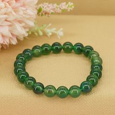 Step into a world of rejuvenation and abundance with our Emerald Jade Bracelet, a symbol of growth, renewal, and prosperity. Crafted from exquisite emerald jade beads, this bracelet serves as a reminder to embrace the endless possibilities of new beginnings and to manifest abundance in all areas of your life. * High-Quality Beaded Bracelet* Unisex Bracelet* 8mm beads* Made to Fit Your Wrist or Anklet* Made with Pure Positive Energy* Great Gift for Everyone Crystals For Pisces, Beaded Bracelet Ideas, Symbol Of Growth, Beads Colors, Emerald Bracelet, Rose Quartz Bracelet, Manifest Abundance, Emerald Bead, Gemstone Beaded Bracelets