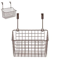 two metal baskets hanging from hooks on the wall