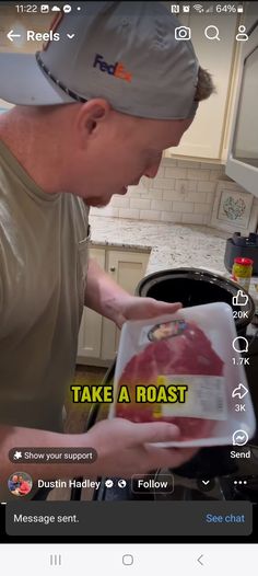 a man is cooking in the kitchen and looking at something on his tablet screen that says take a roast