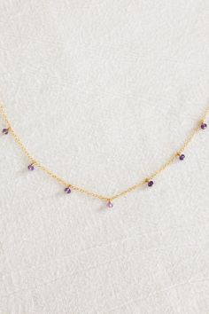 Dainty 14k gold filled plain chain necklace with seven dangling 3mm amethyst stones (February birthstone) Please note: due to the uniqueness of each stone, the shape/colors may vary and will not look exactly like the photos If you would like a different length that is not listed, please consider purchasing an extender chain or contact us for a custom order! February Vibes, Amethyst Stones, Jewelry Workshop, Vibrant Purple, Swimwear Online, February Birthstone, In Full Bloom, Jewelry Repair, February Birth Stone