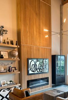 a living room filled with furniture and a fire place in the middle of a room