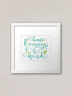 a framed print with the words have courage and be kind in green lettering on it