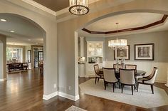 a dining room and living room are shown in this home's open floor plan