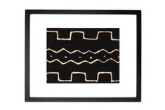 a black and white frame with an abstract design