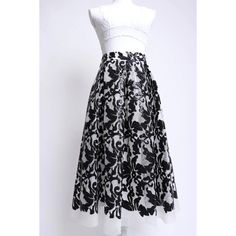 Description: Eliza J 00's black and white sequin mesh floral patterned midi skirt This skirt was designed with comfort in mind Features a soft lined waist with a hidden zipper and black elastic inserts on either side The white polyester mesh is soft and squishy and decorated with little black sequins in a pretty floral pattern The pleated waist gives way to a full skirt, and it has silky lined pockets Fully lined in white polyester fabric Model is 5'11" Waist 29" Hips 40" Length 30" Details: Siz Black Sequined Skirt For Spring, White Midi Party Bottoms, White Midi Length Party Bottoms, Black Contrast Sequin Bottoms For Summer, Black Summer Bottoms With Contrast Sequin, Lace Midi Skirt For Evening, Black Maxi Skirt For Spring Party, Floral Print Full Maxi Skirt For Party, Black Contrast Sequin Summer Bottoms