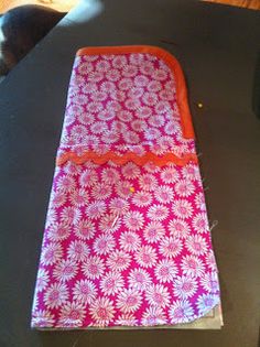 an orange and pink case sitting on top of a table