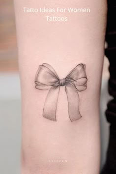 a woman's tattoo with a bow on the side of her arm that reads, tattoos ideas for women tatoos