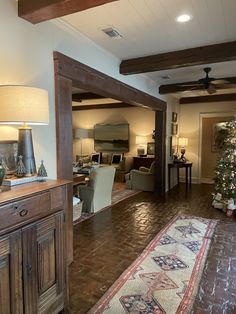 a living room filled with furniture and a christmas tree