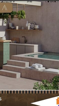 an outdoor kitchen with steps leading up to the swimming pool and potted plants in pots