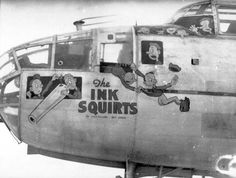 black and white photograph of an old airplane with cartoon characters painted on the front window