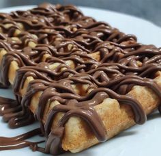 chocolate drizzled on the top of a pastry