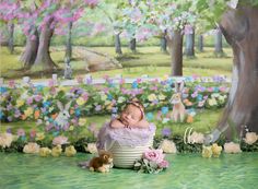 a baby is sleeping in a basket surrounded by flowers