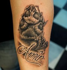 an arm tattoo with the word annn on it