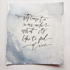 a piece of paper that has some type of writing on it with the words written in cursive ink