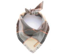 a gray and orange plaid bandana with a small bow on the top of it