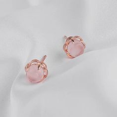 Step into a world of elegance & love with our Navya rose quartz stud earrings, designed to bring sophistication to any ensemble. Each earring features a beautifully inlaid rose quartz gem, revered as the stone of unconditional love. The rose quartz gemstone is believed to open the heart chakra, fostering love, compassion, and emotional healing. Wearing these rose quartz earrings can help you connect with your inner self and foster loving relationships with those around you. Dressed up or down th Rose Quartz Earrings, Rose Quartz Gemstone, Relationships Love, Heart Chakra, Gold Earrings Studs, Pink Rose, Crystal Jewelry, Rose Quartz, Women's Earrings