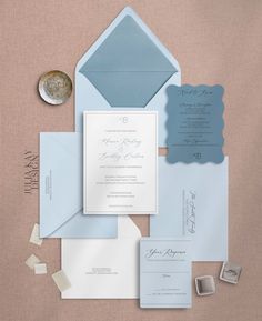 the wedding stationery is laid out and ready to be put into their guests'envelopes