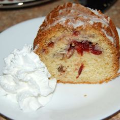 a piece of cake and whipped cream on a plate