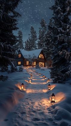 a snowy path leading to a cabin at night with lit lanterns in the foreground