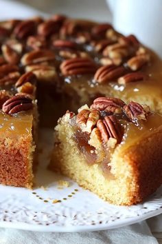 a piece of cake with pecans on top