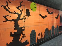 a wall with halloween decorations painted on it