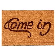 a door mat that says come in