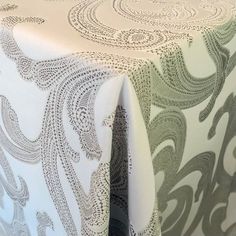 the table cloth has an intricate design on it