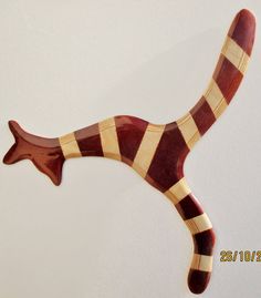 a wooden animal is hanging on the wall