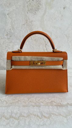 *The bag comes in full set with original store receipt. Designer Orange Bags For Formal Occasions, Elegant Orange Shoulder Bag For Formal Occasions, Luxury Orange Bag For Formal Occasions, Elegant Orange Shoulder Bag With Dust Bag, Designer Orange Formal Bags, Formal Orange Shoulder Bag With Palladium Hardware, Luxury Orange Office Bag, Luxury Formal Orange Bag, Luxury Orange Formal Bag