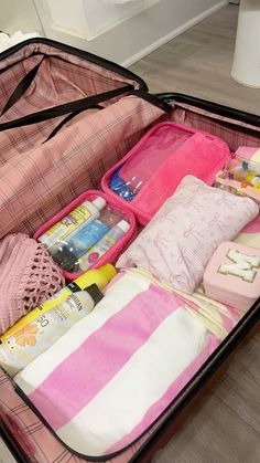 an open suitcase filled with personal care items