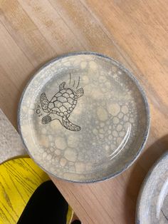 a plate with a drawing of a turtle on it