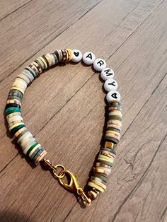 Hand made by fourth grade friends.Letter beads that say army with two black hearts camouflage colors with cubed gold accent beads. Finished with a lobster claw clasp. Wear it on its own or with a bracelet stack. Army Clay Bead Bracelet, Camo Clay Bead Bracelet, Army Bracelets, Green Clay Bead Bracelet, Friends Letter, Different Shades Of Brown, College Jewelry, Clay Bracelets, Clay Bead Necklace