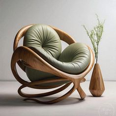 a wooden chair with a green cushion next to a vase