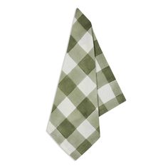 two green and white checkered napkins sitting on top of each other