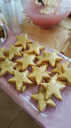 some gold stars are on a plastic tray