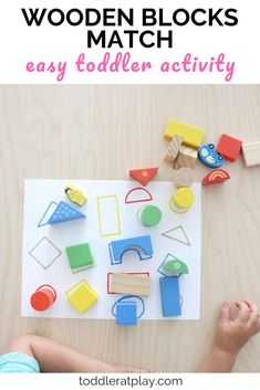 a toddler playing with wooden blocks and toys on the floor in front of them