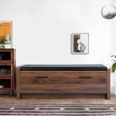 a living room with a large wooden chest and bookshelf