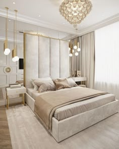 a large bed sitting in a bedroom under a chandelier