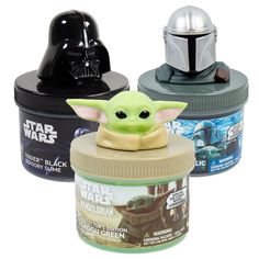 star wars yoda and the child's helmet on top of two jars with lids