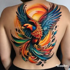 the back of a woman's body with colorful tattoos on her chest and an eagle