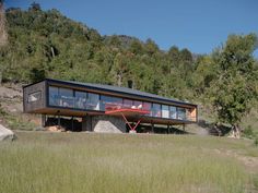 a modern house on the side of a hill