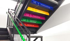 there is a stair case with different colors on it